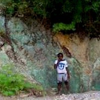 Road cut through copper mineralization in northern Haiti